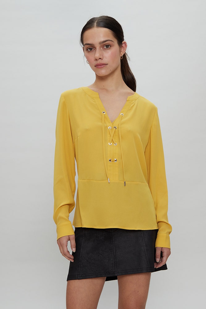 BLUSA CON LAZOS CRUZADOS