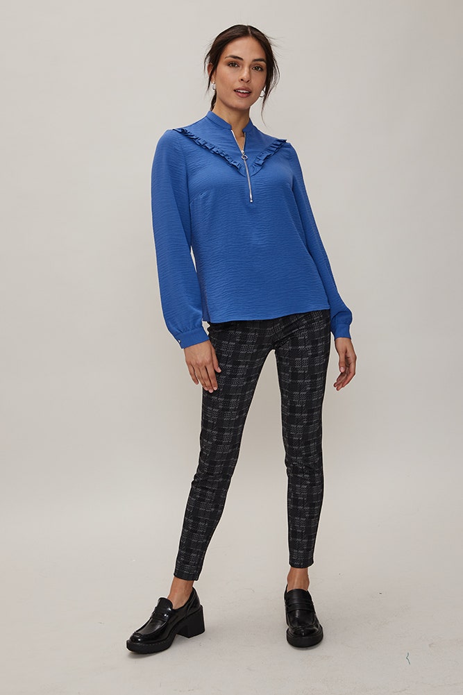 BLUSA CON CIERRE Y VUELOS 
